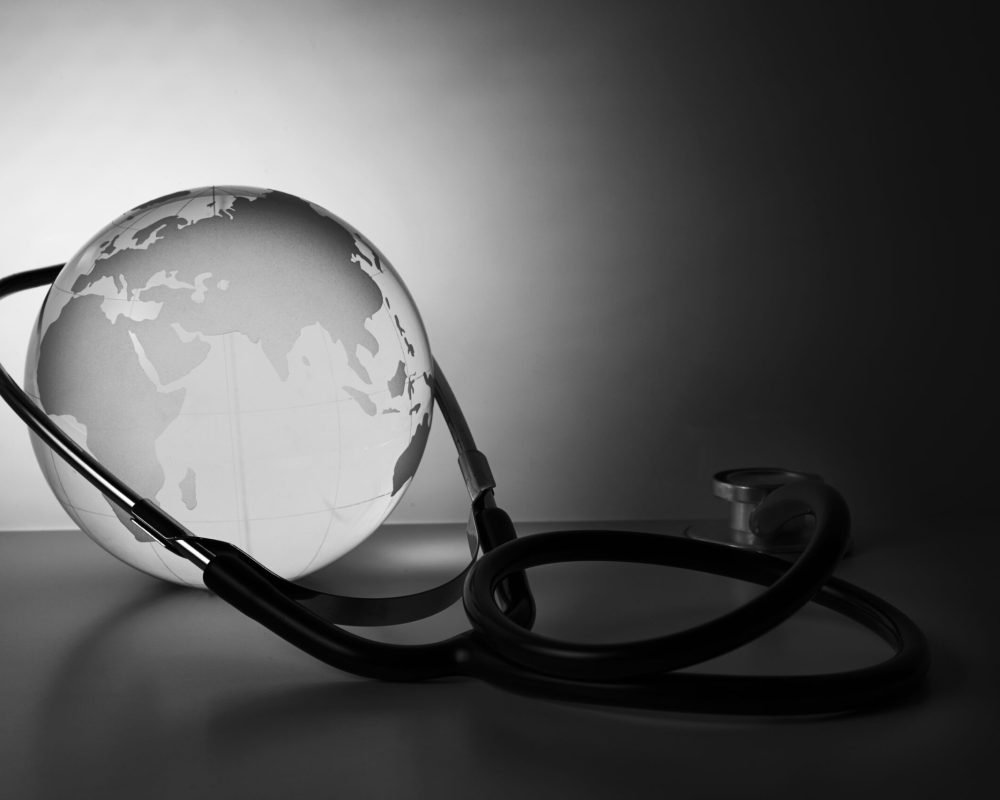 Global healthcare. Globe and stethoscope, studio shot.